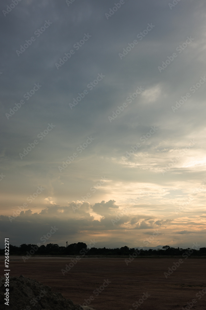 Sky during overcast, storm at evening. Include many gray clouds, empty space, light nature, sunset sunrise, horizon skyline, land or landscape at outdoor for background. Concept of disaster, danger. Sky during overcast, storm at evening. Include many gray clouds, empty space, light nature, sunset sunrise, horizon skyline, land or landscape at outdoor for background. Concept of disaster, danger.