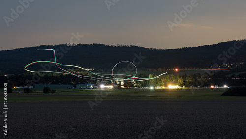 Flugshow bei Nacht beim Taunus Flugfest auf dem Flugplatz Neu-Anspach / Wehrheim Obernhain im Hochtaunuskreis, Hessen photo