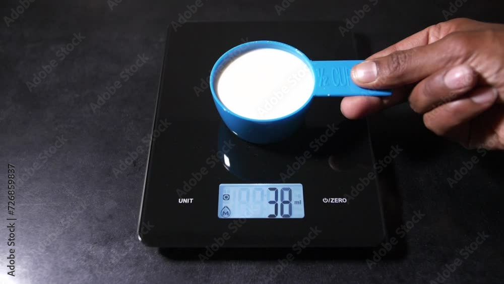 Kitchen Food Scales LCD Displays half a Cup of Milk as 125 Milliliters Kitchen Food Scales LCD Displays half a Cup of Milk as 125 Milliliters
