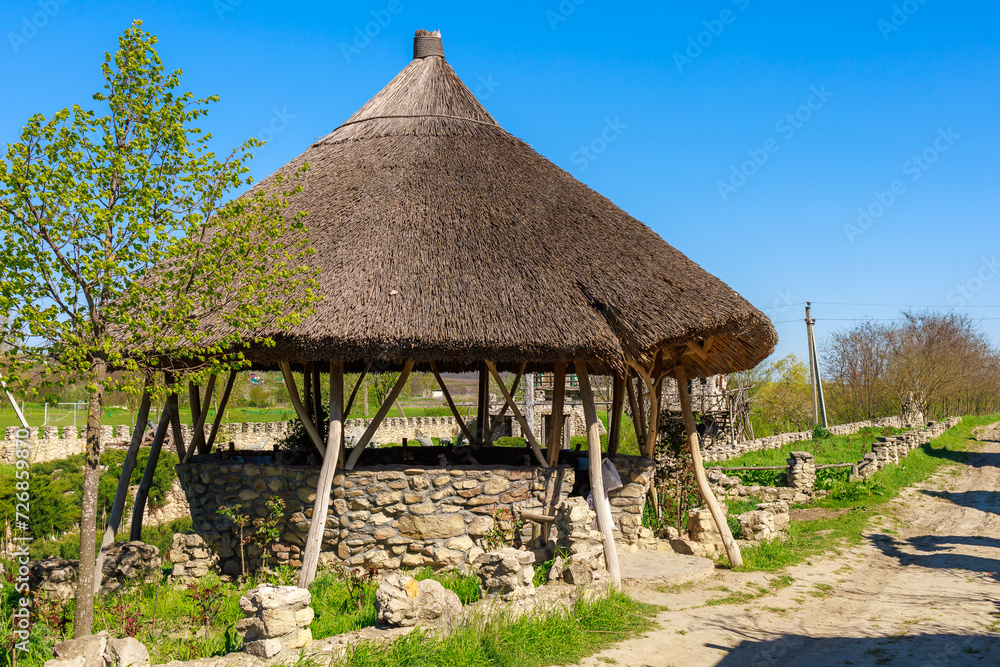 Ancient reed roof of the gazebo. Background with selective focus and copy space