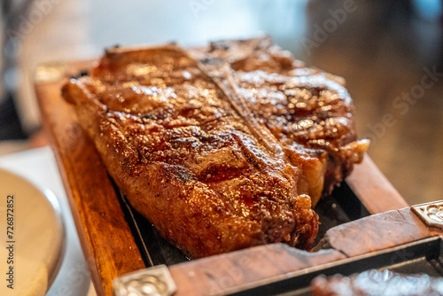 grilled steak on wooden table