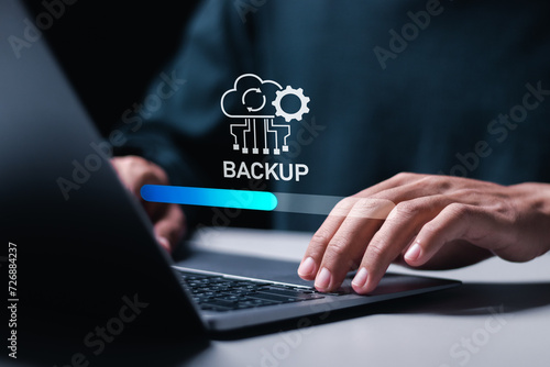 Photography Backup concept, Person use laptop with virtual Backup status bar for data backup management