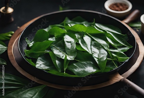 wok Pucuk cooked Ubi local black known Freshly tapioca's leaf commonly It photo