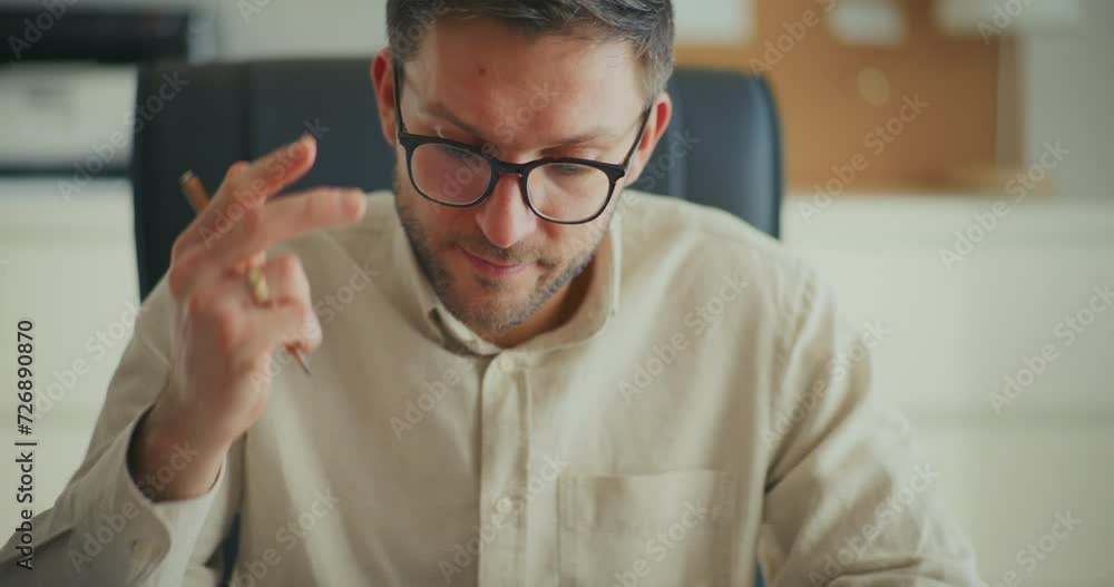 Tensed businessman working at office Tensed businessman working at office