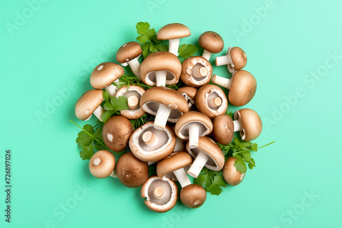 Group of fresh champignon mushroom isolated on pastel green background. Raw food concept Flat lay composition