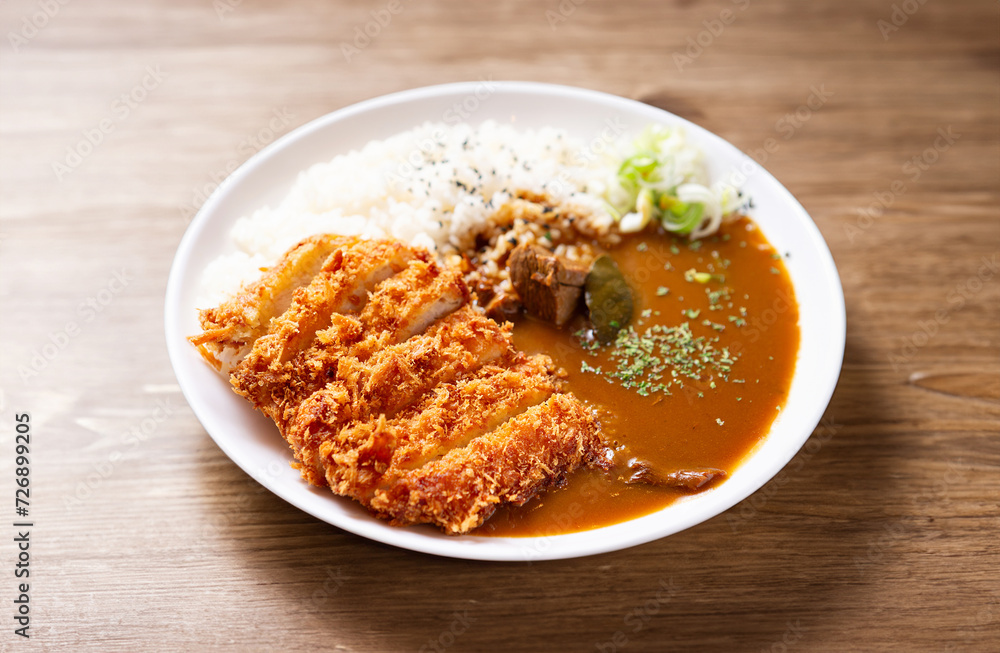 Pork cutlet with delicious Curry sauce on a plate Pork cutlet with delicious Curry sauce on a plate