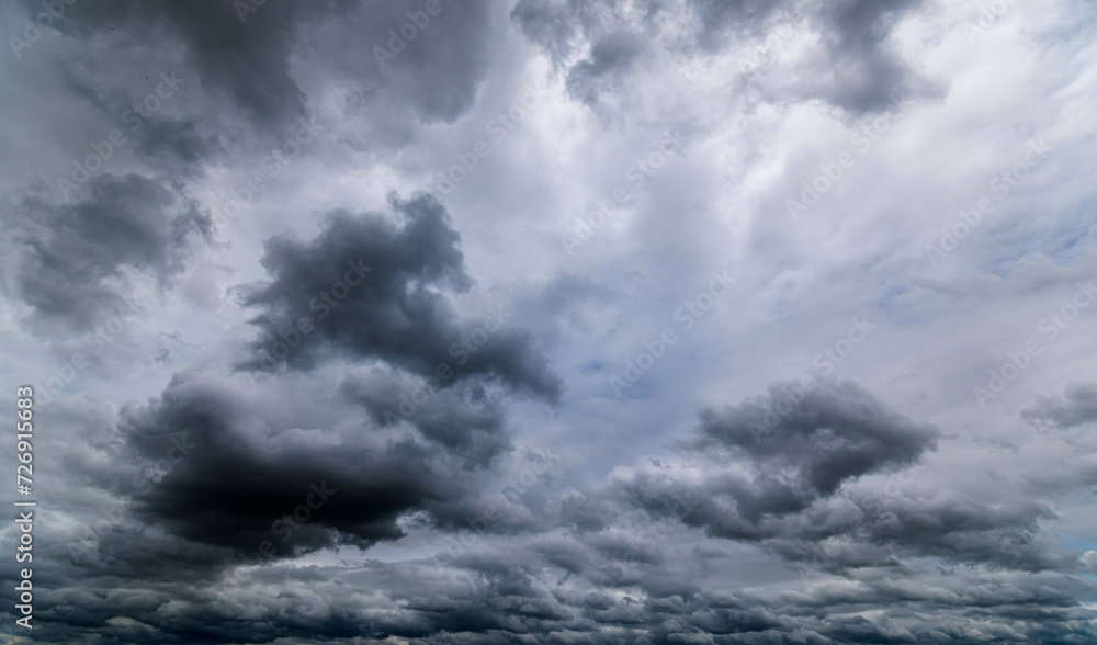 Obraz premium Dark sky with stormy clouds. Dramatic sky rain,Dark clouds before a thunder-storm.