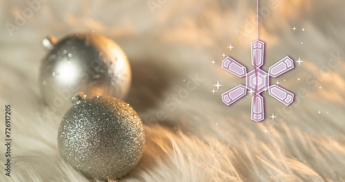 Image of snowflake christmas decorations with baubles on white background