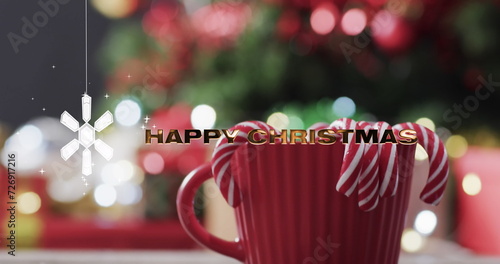 Image of happy christmas text over snowflake and christmas tree background