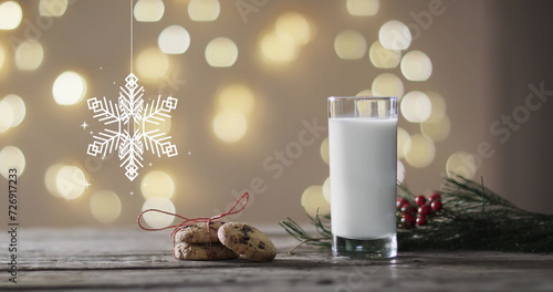Image of snowflake christmas decorations, cookies and glass of milk on grey background