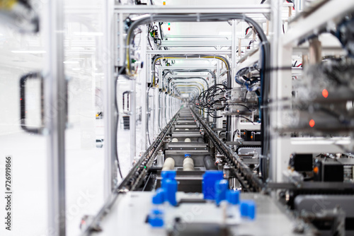 Inside view of high tech automated industrial machine producing electronics components.