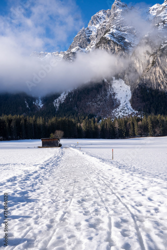 Idyllic winter landscape: Winter hiking trail in front of Leutascher Dreitorspitze 2682m, Wetterstein Mountains, Austria in winter