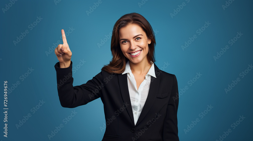 Smiling business woman pointing up and looking at camera Smiling business woman pointing up and looking at camera