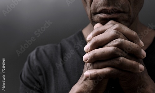 Photography black man praying to god Caribbean man praying with people stock image stock pho