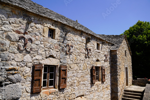 Hures la Parade french village with old museum farm Caussenarde typical ancient building  in lozere aveyron © OceanProd