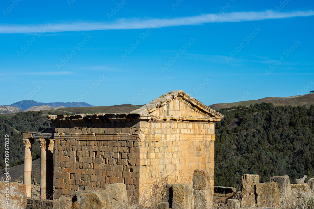 High-angle view of a Roman temple against the sky in the ancient Roman town of Djemila, Setif, Algeria.