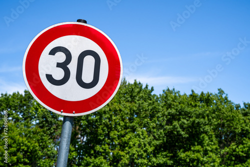 Speed sign 30 kilometer per hour photo
