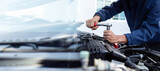 Car service , Professional mechanic working on the engine , repairing a car engine automotive workshop with a wrench, car service and maintenance ,Repair service.