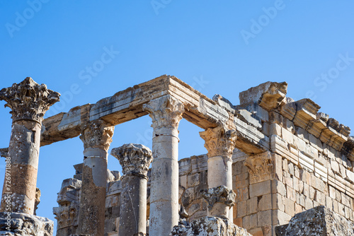 Low-angle view of Roman columns against the sky in the ancient Roman town of Djemila, Setif, Algeria.