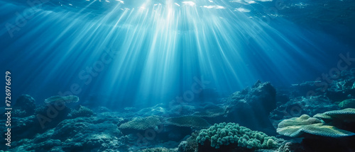 Underwater seascape with sun rays and coral reef. 