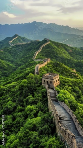 The image shows the Great Wall of China snaking through lush green hills under a cloudy sky., generative ai photo
