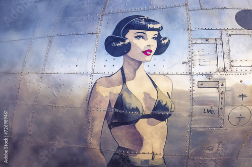Water colour Illustration of vintage World War 2 Bomber Girl Pinup Girl Nose Art painted on the side of a military aircraft