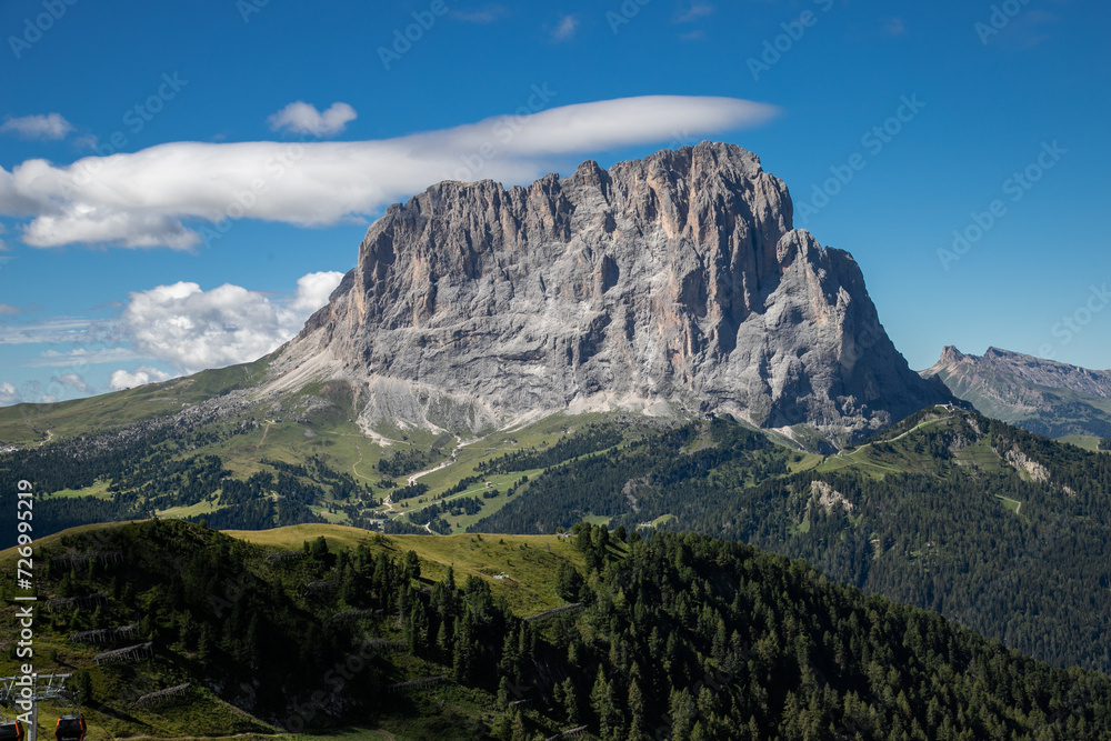 Sassolungo mountain seen from Dantercepies in Val Gardena on a sunny day, Dolomites, Trentino, Alto Adige, Italy