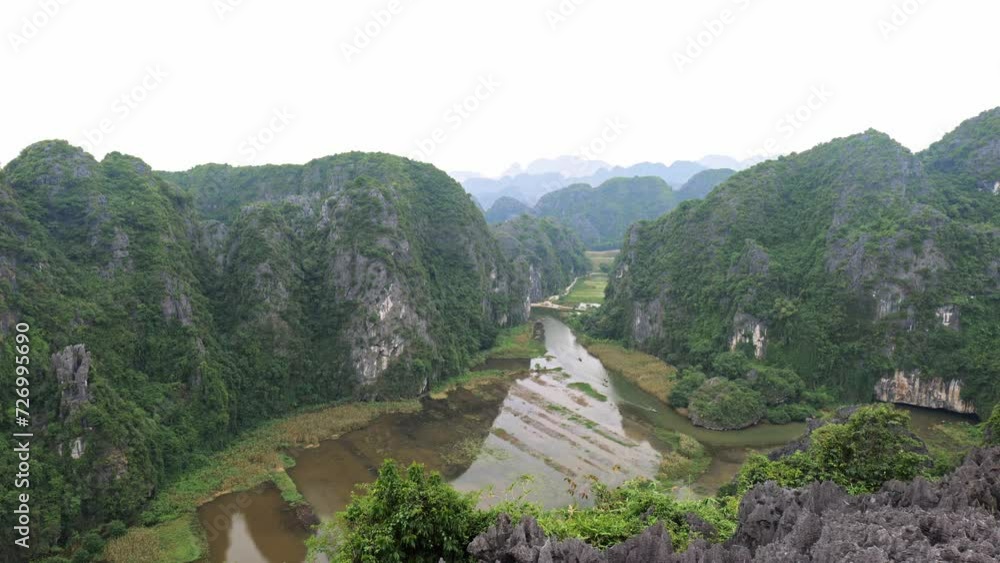 Ninh Binh landscape in Vietnam. Popular for boat tour, karst landscape and river Ninh Binh landscape in Vietnam. Popular for boat tour, karst landscape and river