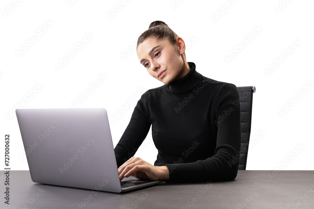 Attentive businesswoman using laptop, focused on screen, modern workplace Attentive businesswoman using laptop, focused on screen, modern workplace