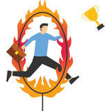 Business challenge, obstacle, risk or danger to overcome in order to achieve success, businessman skillfully jumps through hot hoops to win the victory trophy.

