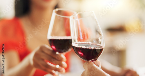 Couple, hands and toast with red wine for celebration of love, romance and valentines day on their anniversary. People or lover on date with glasses, drinks and alcohol for cheers, success and luxury
