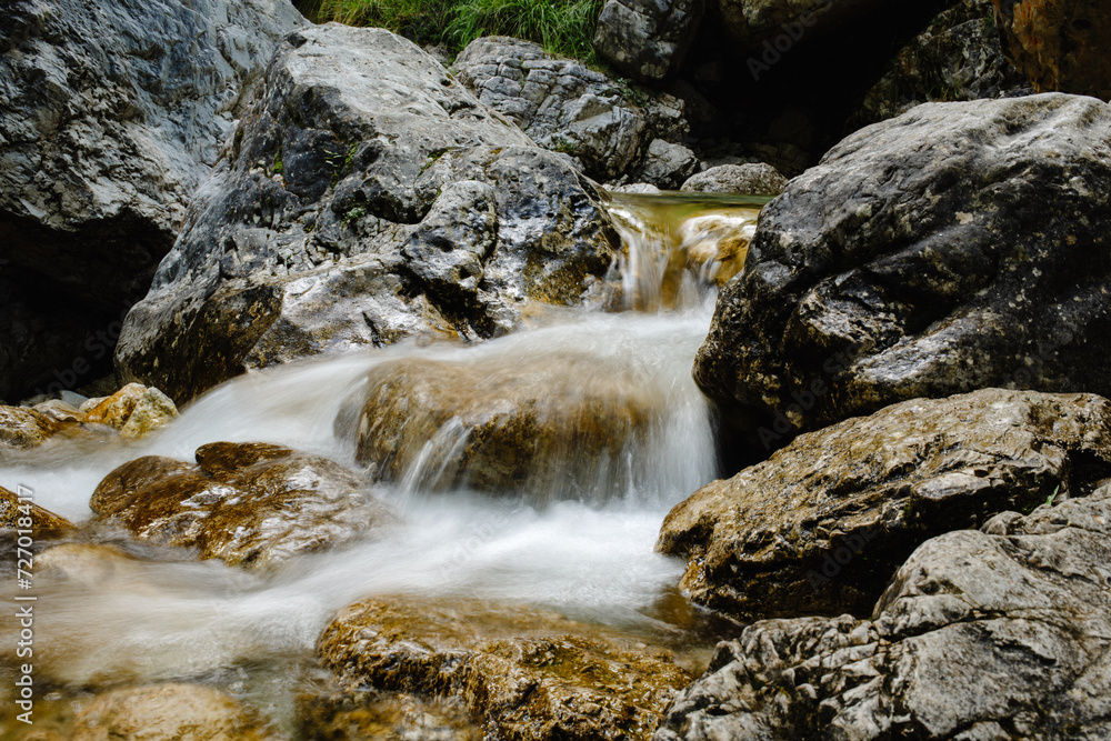 Mountain River with Blurred Motion, Creating a Silky Smooth Water Flow.