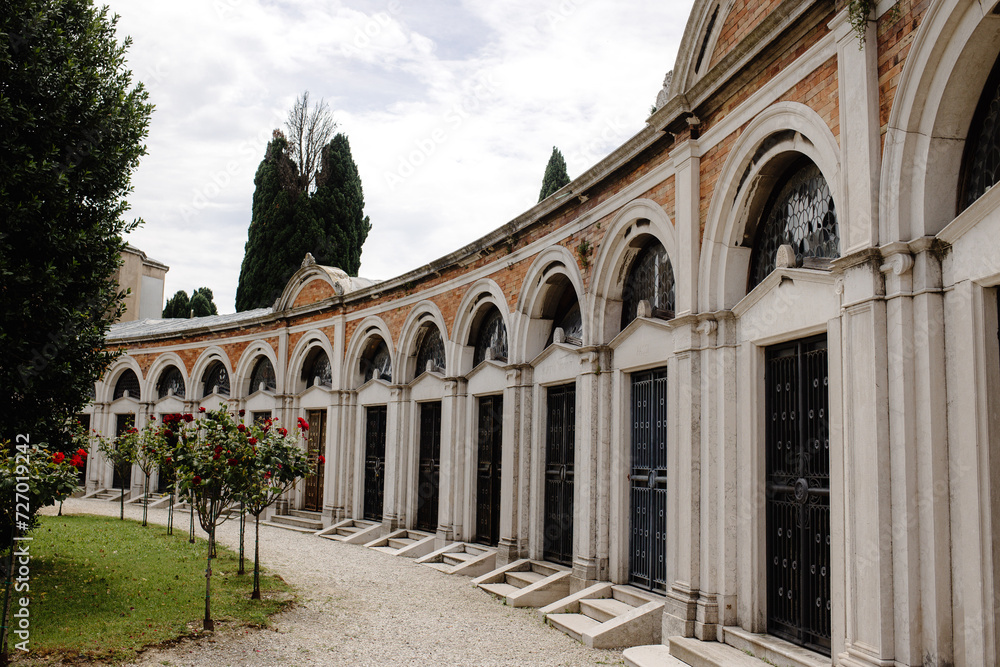 Elegant Exteriors of Historic Cemetery Buildings with Arched Doors and Windows