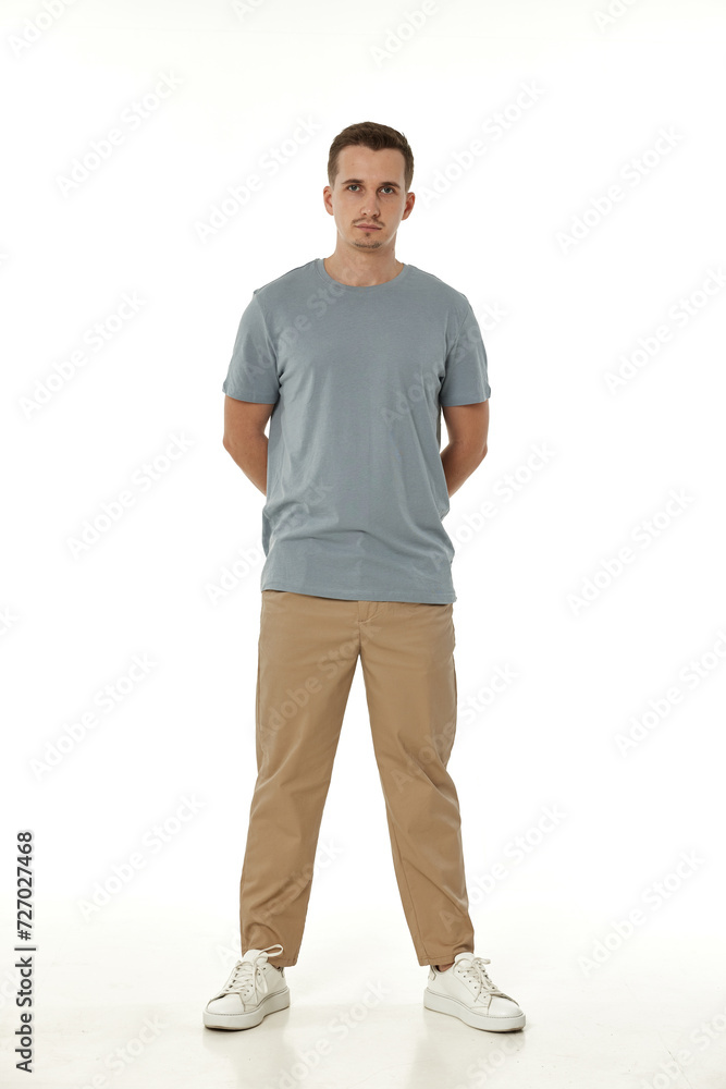 Fototapeta premium handsome young calm man on white background