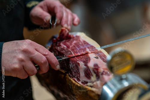 the hands of a pata negra Iberian ham cutter