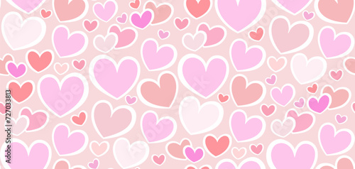 Pink hearts scattered on white seamless background