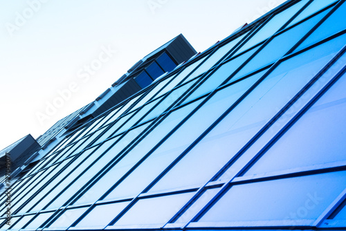 glazed facade. glazed facade against a blue background. modern skyscrapers of downtown.