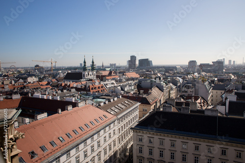 Big city in Austria. Foggy horizon over the city. Tall buildings of Vienna in the fog. Bird's eye view. #727066615
