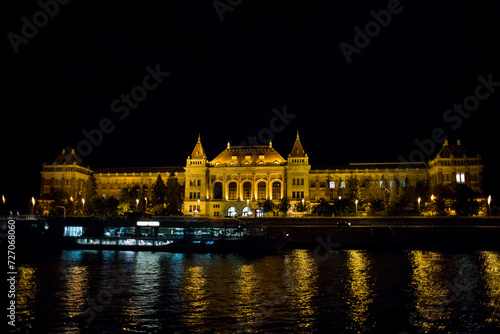Castle on the shore of Budapest at night. Evening in the capital of Hungary. Panoramic view of the palace. A place to relax on the banks of the Danube River. View of Budapest at night.
