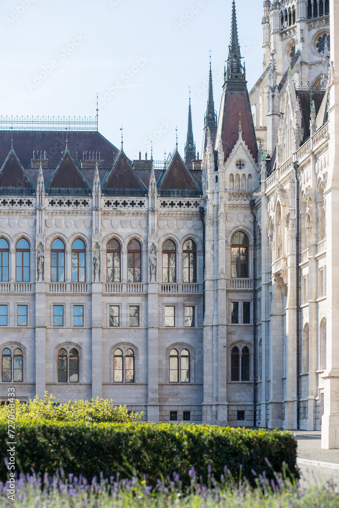 Corner of a building with an unusual stylish facade. Inner courtyard of the European Parliament in Budapest. Hungarian Parliament. Stylish Gothic building.