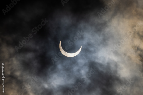 Partial phase of the annular solar eclipse covered in clouds, San Antonio, Texas USA photo