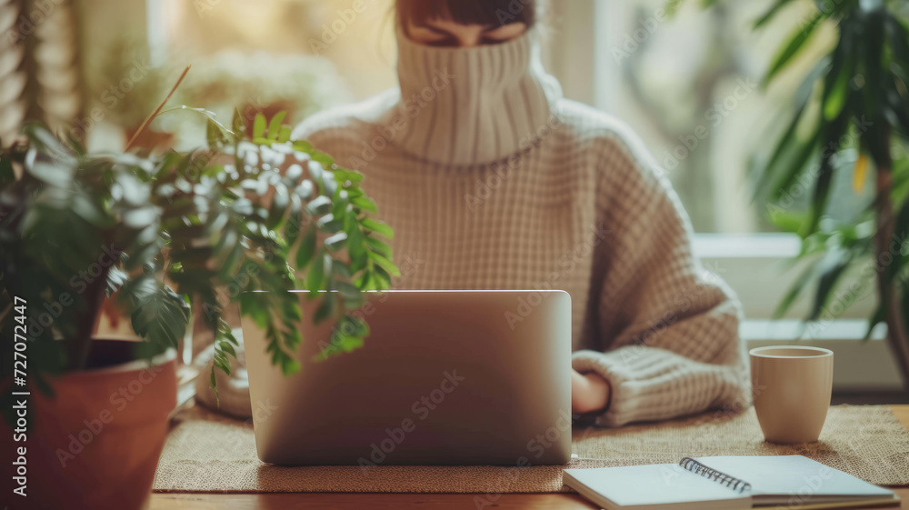A woman is immersed in work at her laptop. A woman is immersed in work at her laptop.