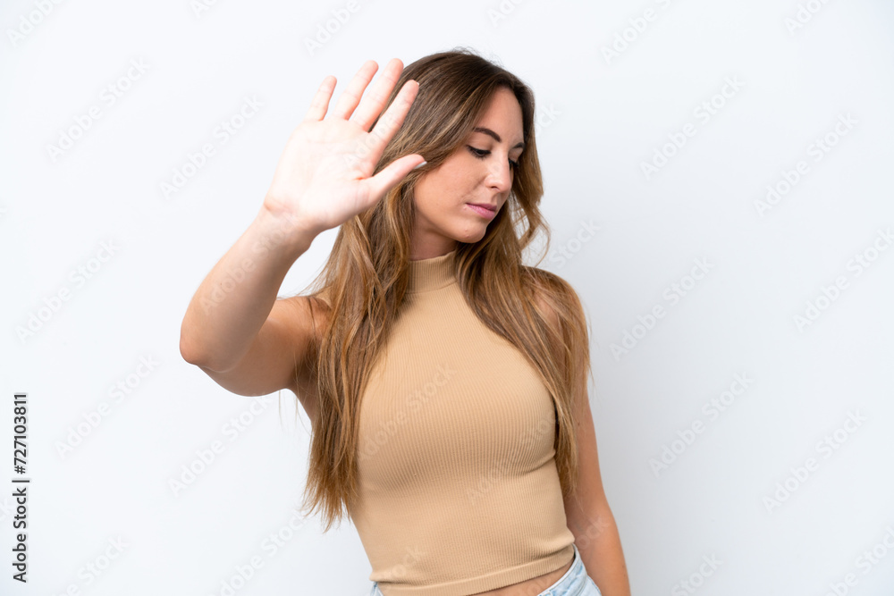 Young caucasian woman isolated on white background making stop gesture and disappointed Young caucasian woman isolated on white background making stop gesture and disappointed
