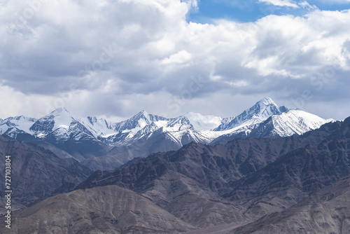 Wide shot landscape view of a mountain range with majestic peaks