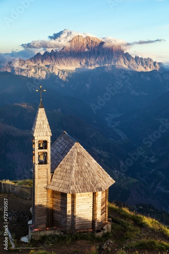 wooden church and mount Civetta Alps Dolomites mountains