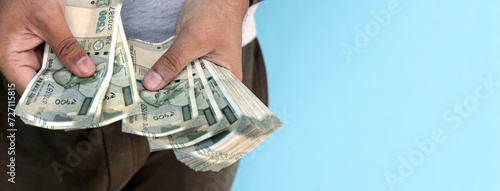 Man counting 500 rupee banknotes