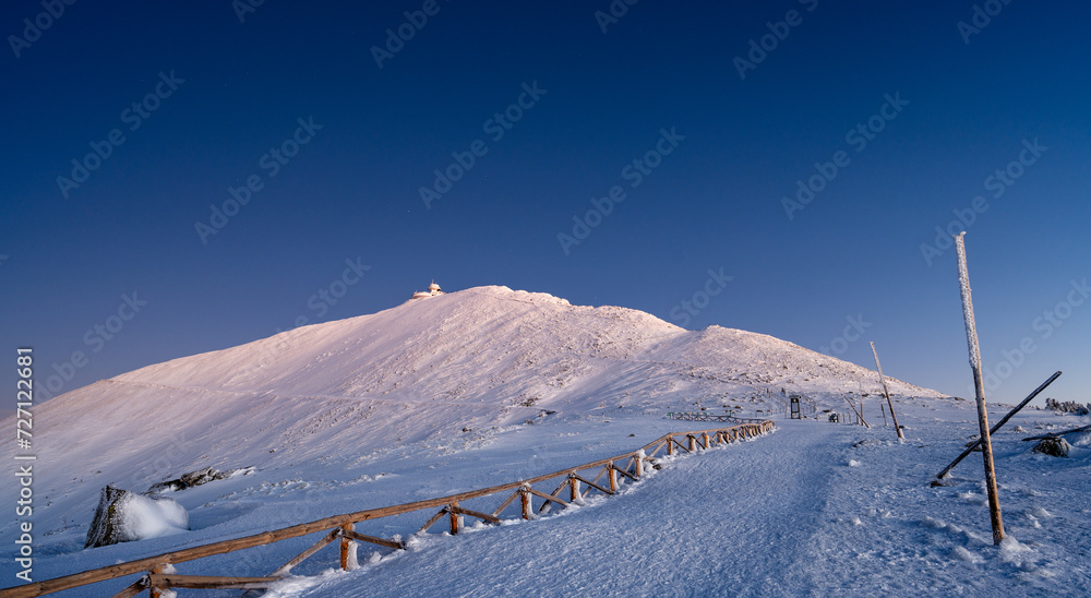 Sniezka mountain at dusk during winter in Giant mountains