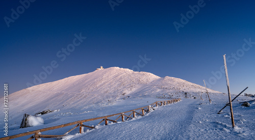 Sniezka mountain at dusk during winter in Giant mountains 