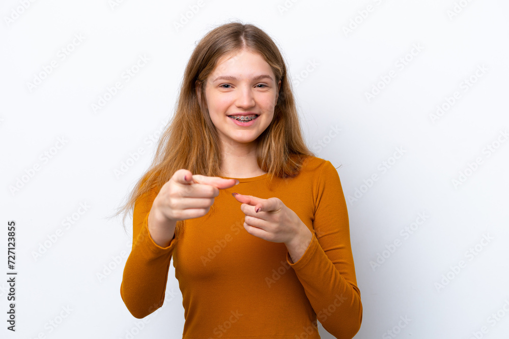Teenager Russian girl isolated on white background surprised and pointing front Teenager Russian girl isolated on white background surprised and pointing front
