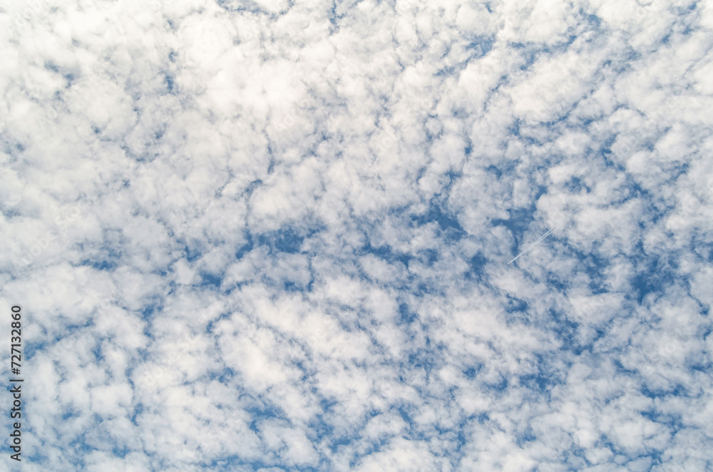 Clouds over blue sky background
